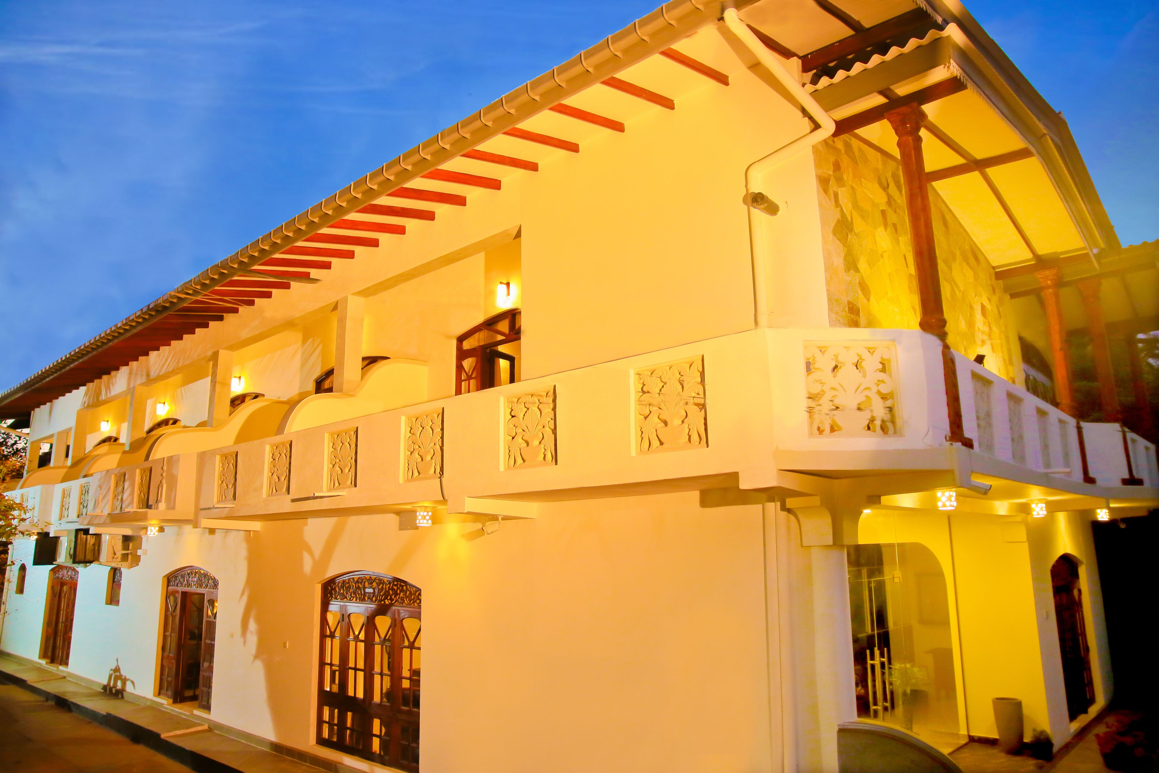 A traditional building with a balcony and decorative elements.