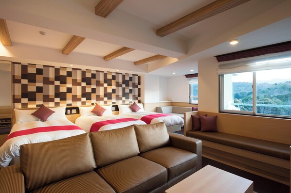 Deluxe Triple Room(Non-smoking) | 1 bedroom, bed sheets