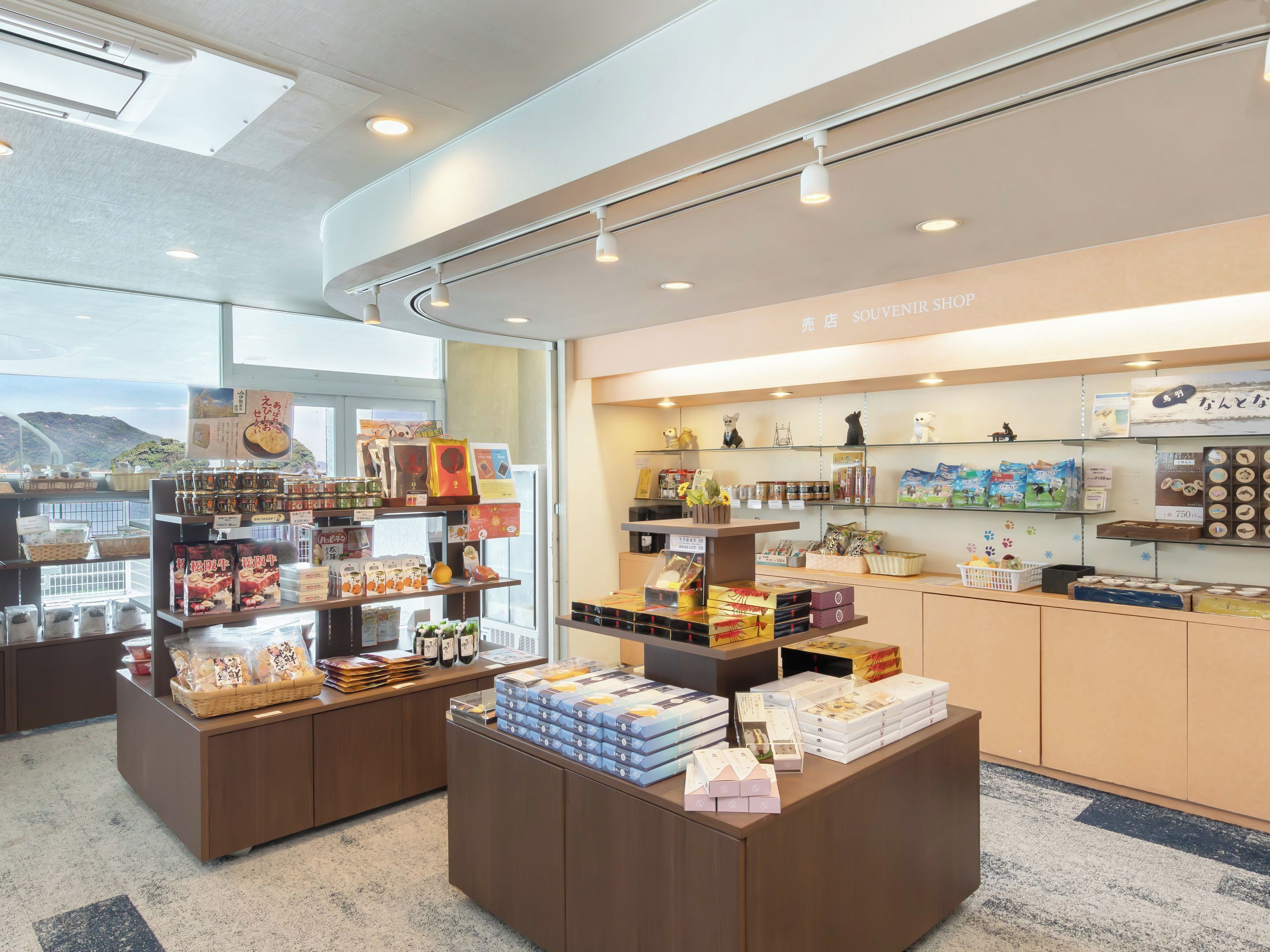 A souvenir shop with various items on display, including boxes and figurines.