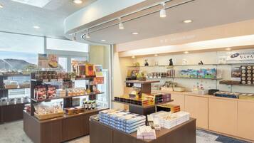 A souvenir shop with various items on display, including boxes and figurines.