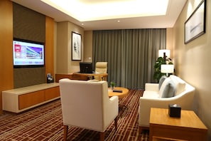 Suíte empresarial | Sala de estar | TV