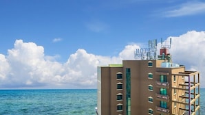 A hotel with multiple floors, balconies, and a view of the ocean. - Port View (Yangyang)