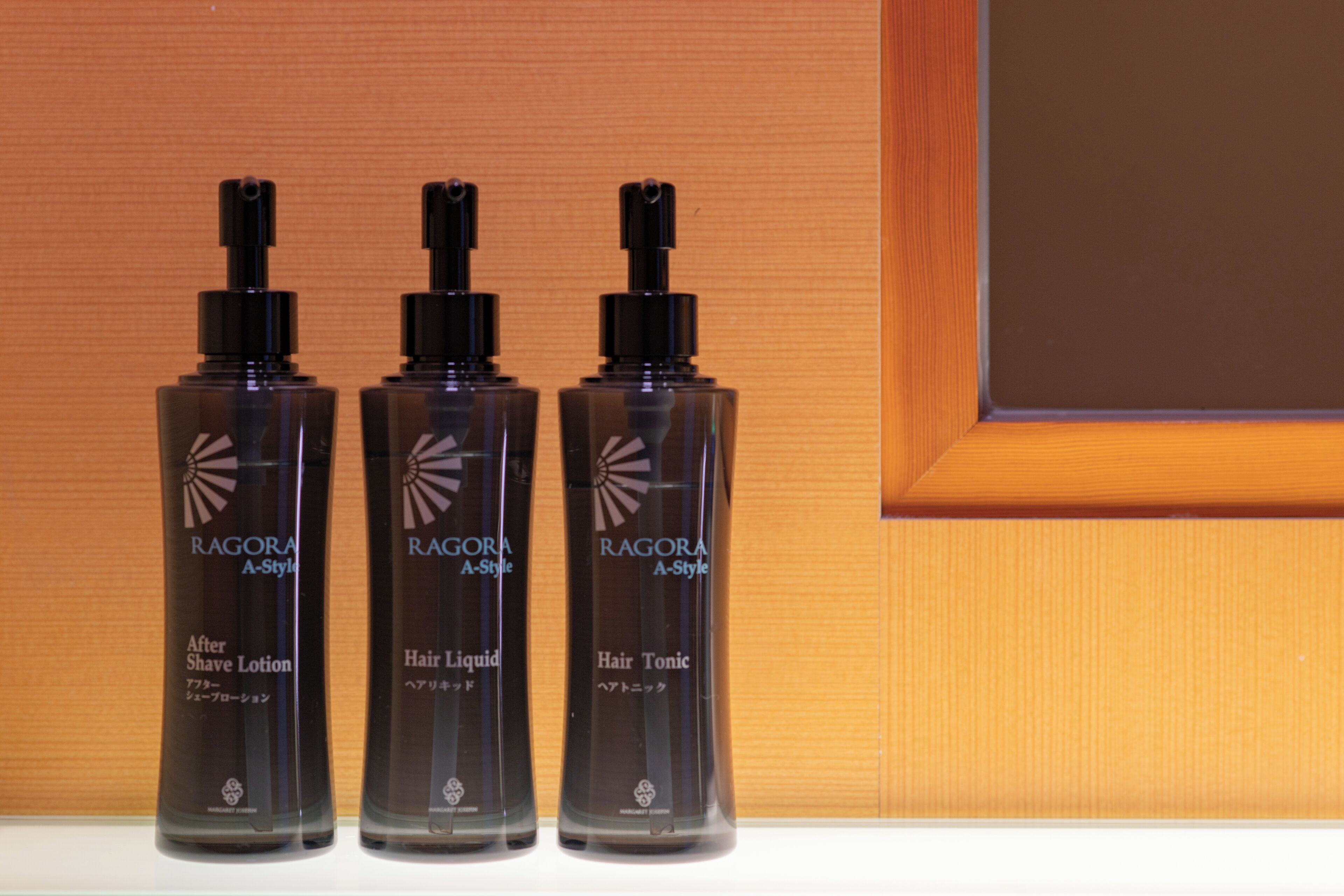 Three bottles of RAGORA A-Style hair care products on a shelf.
