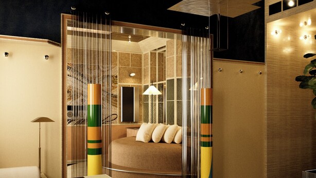 Ein modernes Hotelzimmer mit einer gemütlichen Sitzecke, einer Glastrennwand und einem Bett mit Blick.