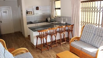 Apartment, 3 Bedrooms | Private kitchen | Full-size fridge, microwave, oven, stovetop