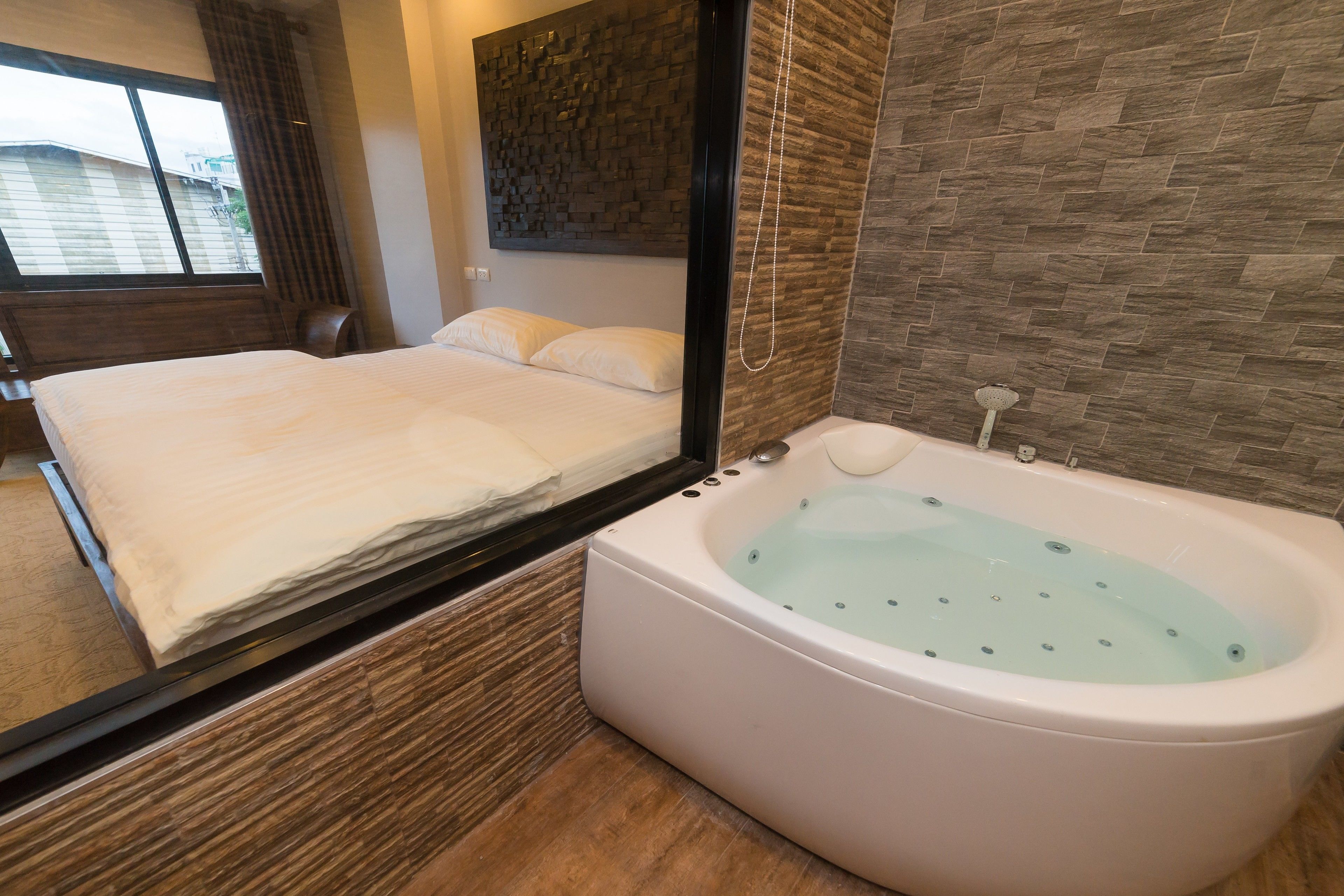 deluxe double room (bathtub) | bathroom | free toiletries, hair dryer, bathrobes, slippers