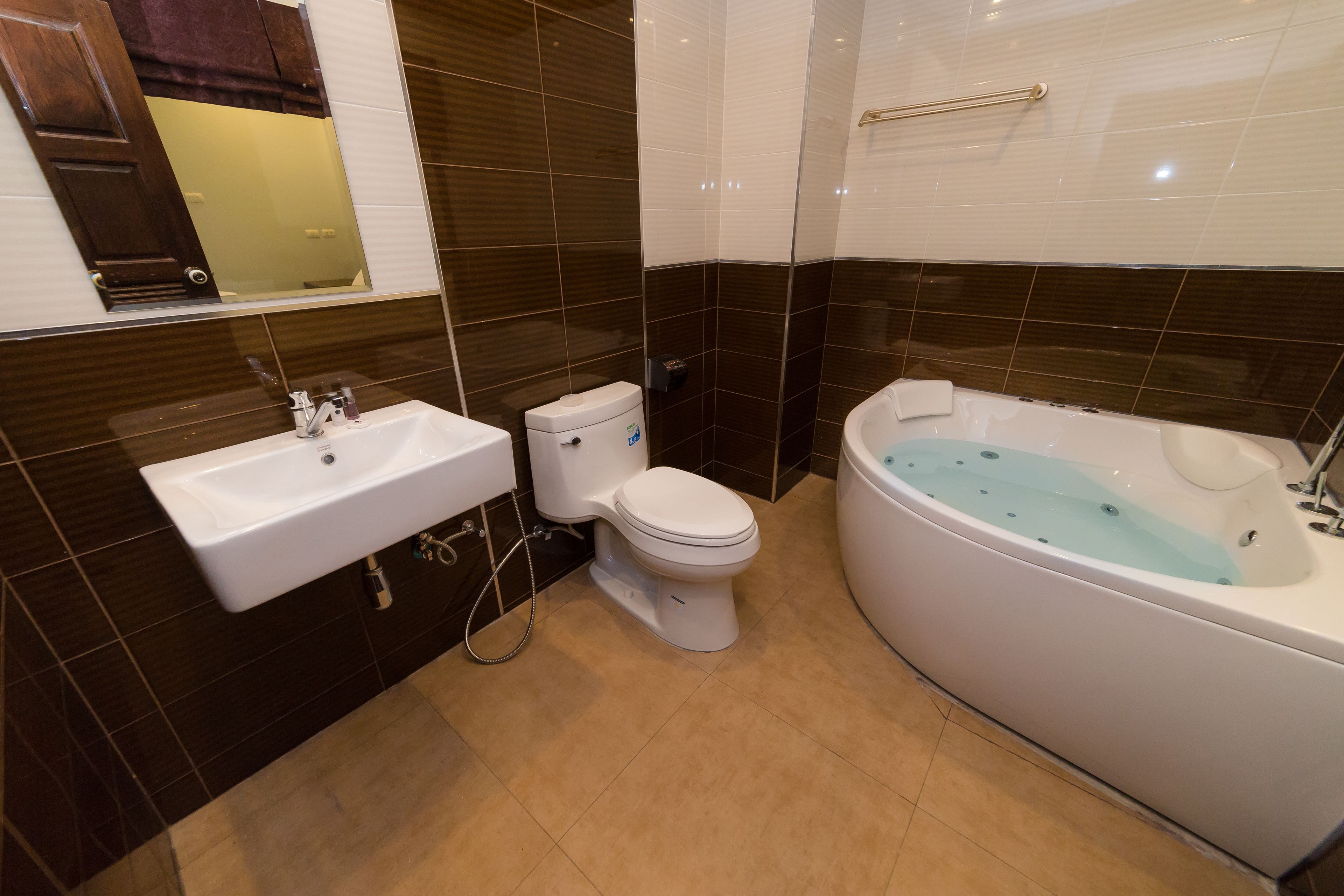 deluxe double room (bathtub) | bathroom | free toiletries, hair dryer, bathrobes, slippers