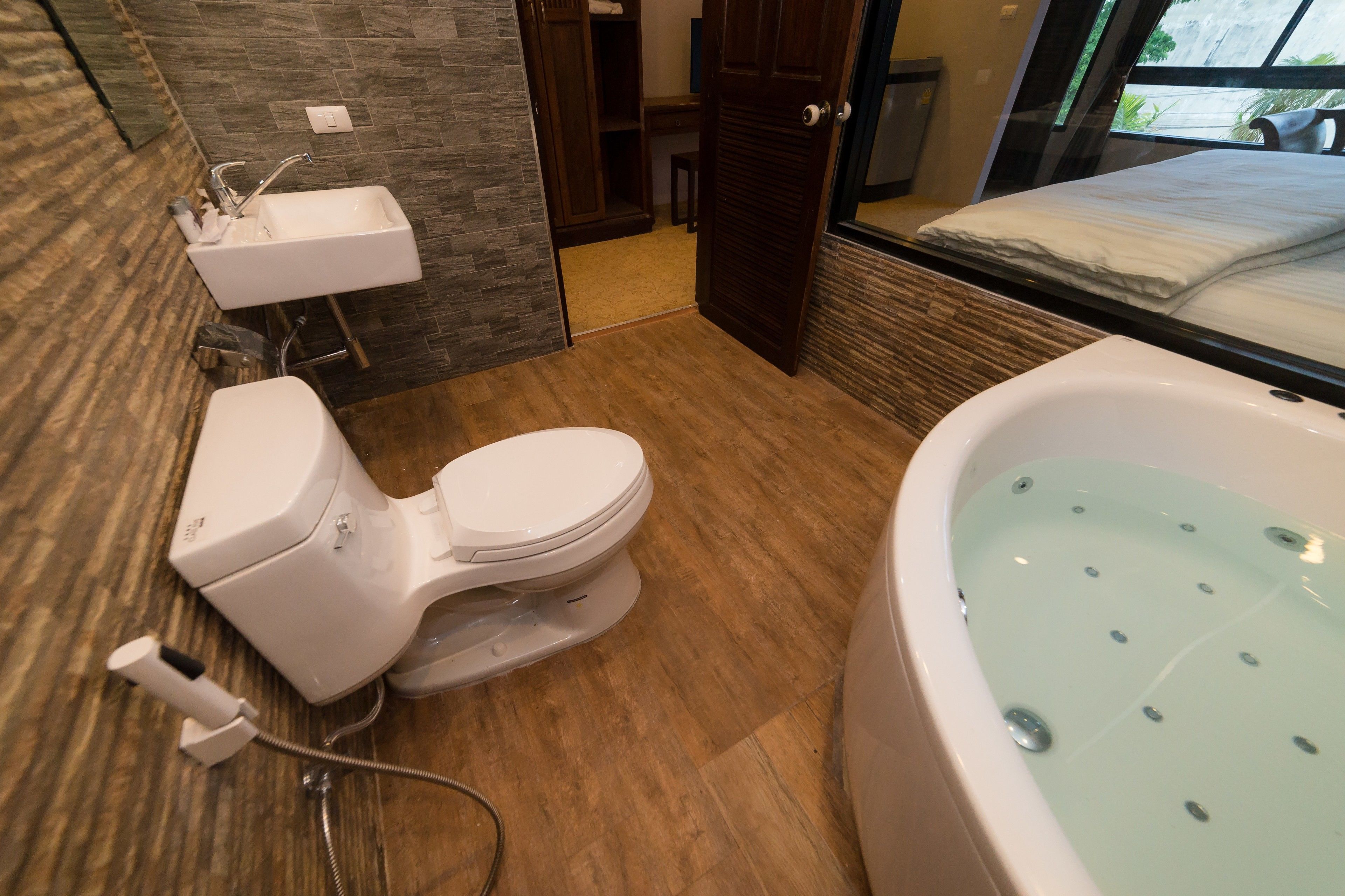 deluxe double room (bathtub) | bathroom | free toiletries, hair dryer, bathrobes, slippers
