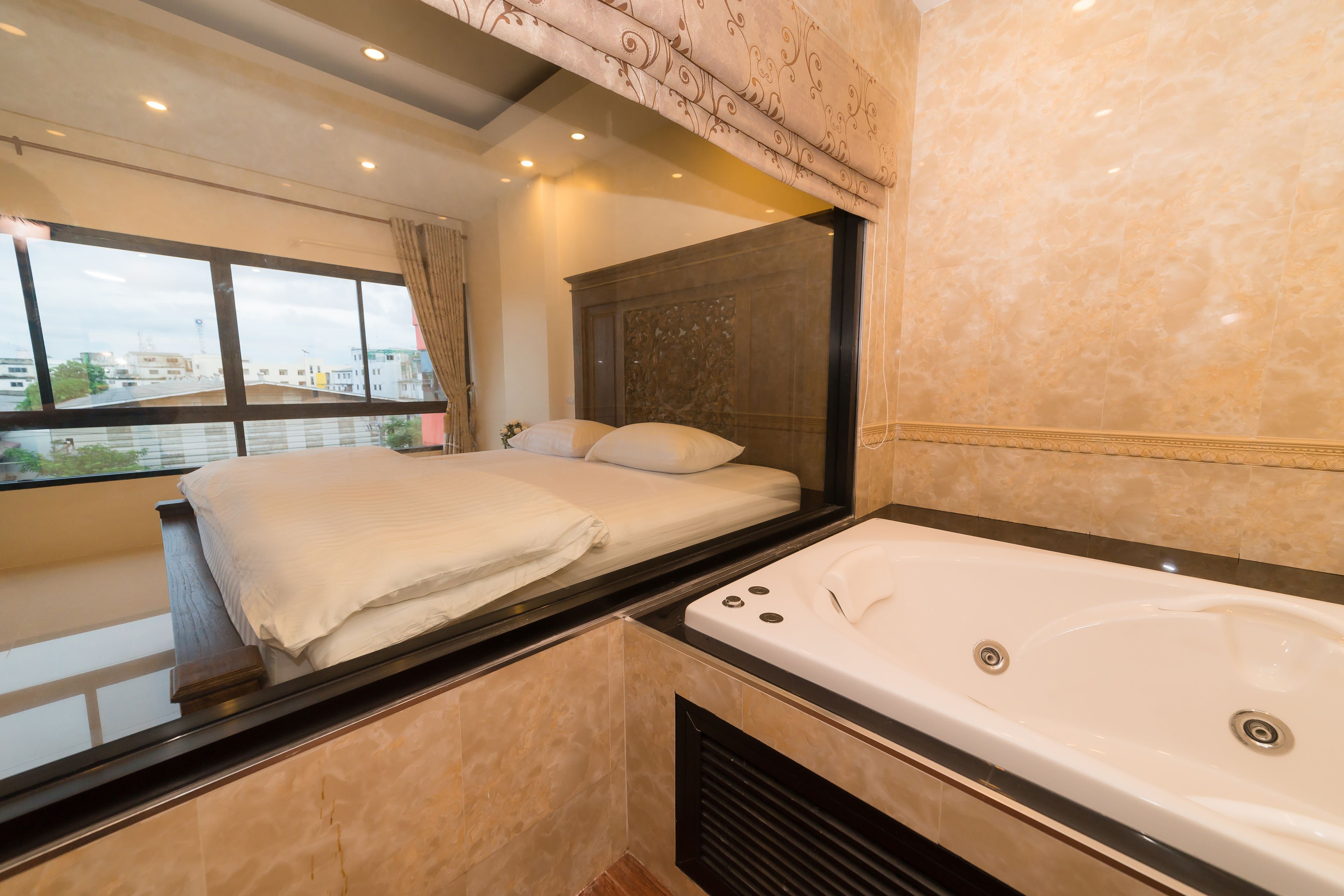 deluxe double room (bathtub) | bathroom | free toiletries, hair dryer, bathrobes, slippers