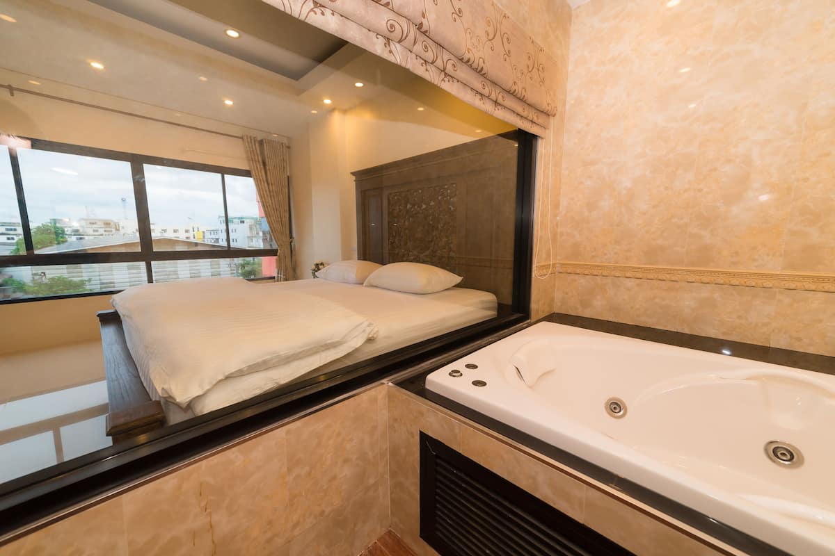 deluxe double room (bathtub) | bathroom | free toiletries, hair dryer, bathrobes, slippers