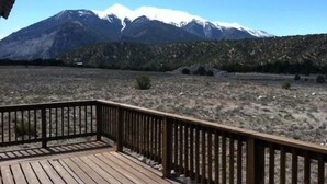 A wooden deck with a mountain view. - Mt Princeton Escape 1 Bedroom Holiday Home By Pinon Vacation Rentals (Nathrop)