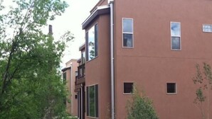 A modern building with multiple windows and a flat roof.