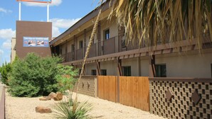 A motel named El Patio Inn with a sign advertising daily and extended stays. - El Patio Inn (San Angelo)