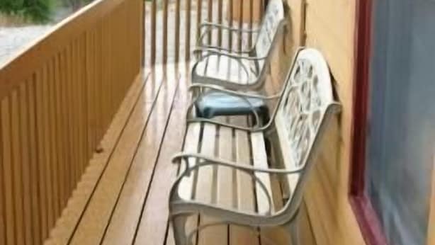 A wooden deck with metal chairs and a view of mountains. - Villa on the Green 2 Bedroom Holiday Home By Pinon Vacation Rentals (Salida)