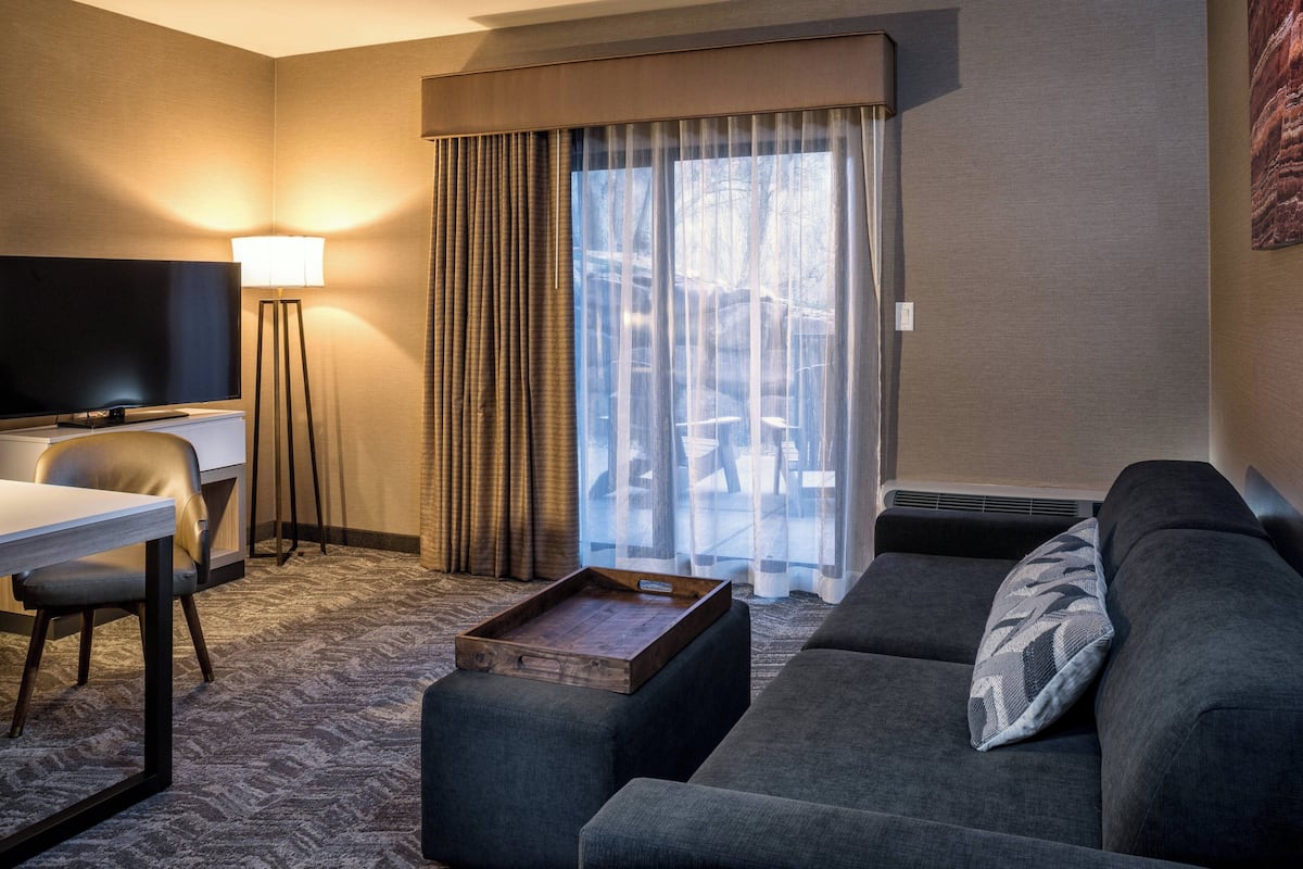 suite, multiple beds | living area | 55-inch smart tv with cable/satellite tv channels, tv, netflix