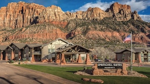 A hotel with a sign reading "Springhill Suites Marriott" in front of a mountainous backdrop. - SpringHill Suites by Marriott Springdale Zion National Park (Springdale)