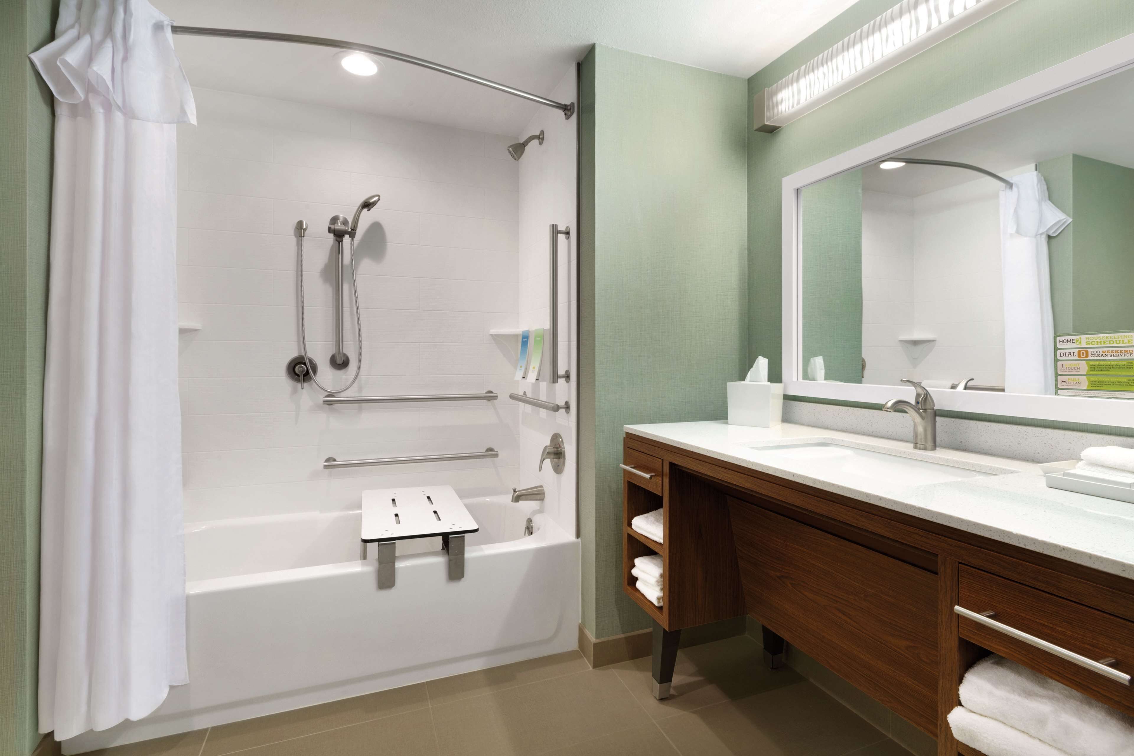 combined shower/bathtub, designer toiletries, hair dryer, towels