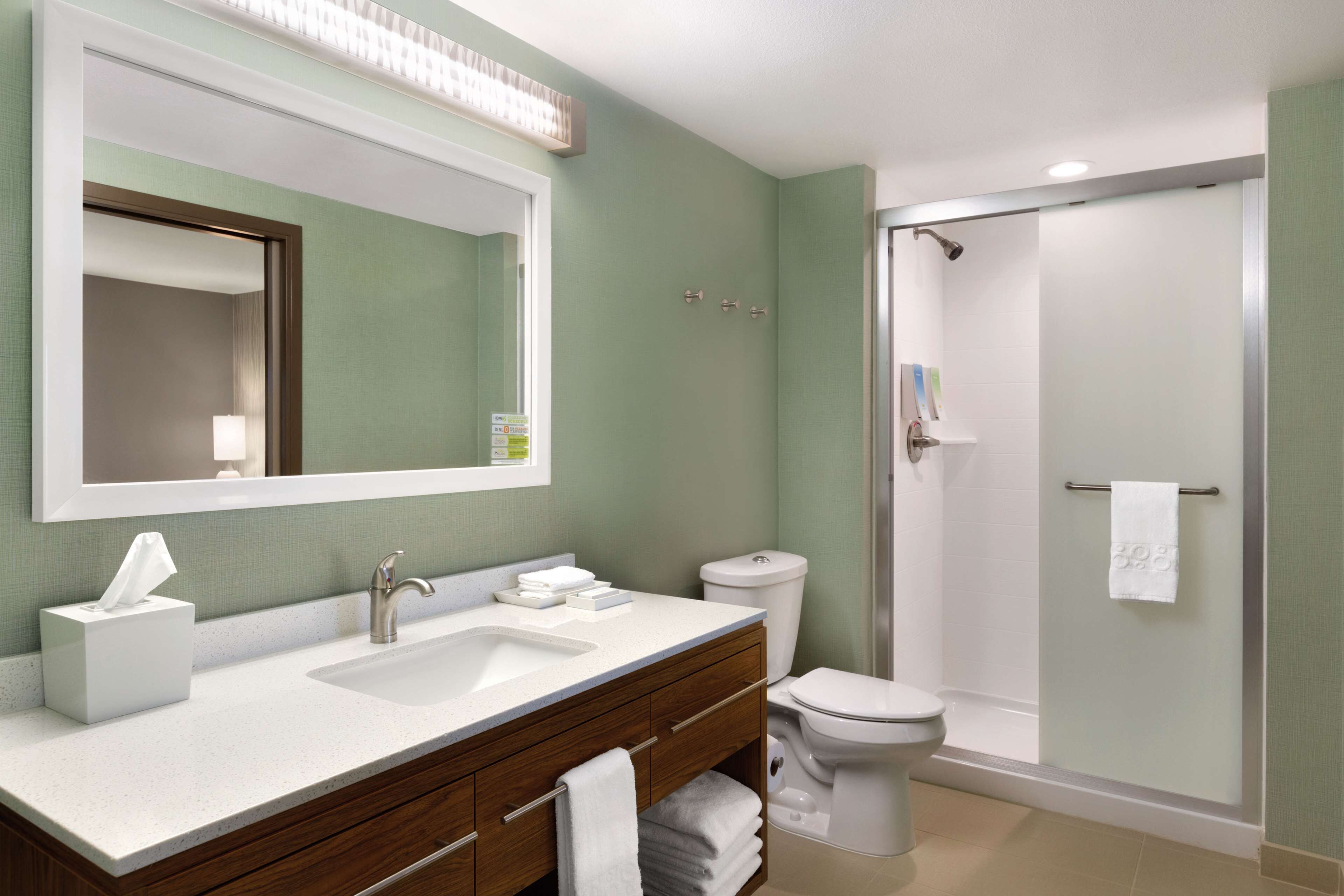 combined shower/bathtub, designer toiletries, hair dryer, towels