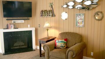Apartment, 1 Bedroom, Sea Facing | Living room | TV, fireplace