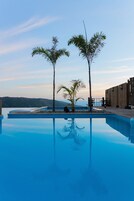 Outdoor pool, pool umbrellas, pool loungers