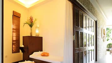 Relax in a stylish room with a large bed, a small table, and a beautiful view of the outdoors.