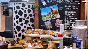 A dairy-themed display with a milk dispenser, a cow-patterned wall, and various dairy products.