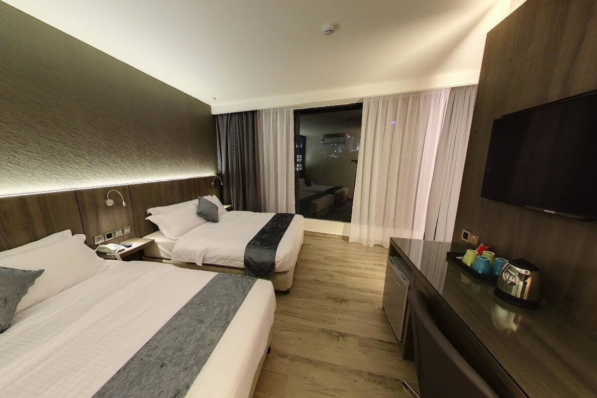 Family Deluxe Room | In-room safe, blackout drapes, soundproofing