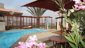 Outdoor pool, pool umbrellas, pool loungers