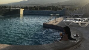 A swimming pool with a view of mountains in the background. - Delora Hotel and Suites (Chtaura)