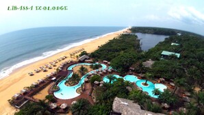 A resort with a beach, a pool area, and a view of the ocean. - Libassa Ecolodge (Marshall)