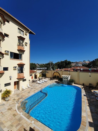 Indoor pool, outdoor pool, open 9 AM to 9 PM, pool umbrellas