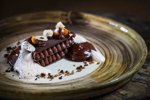 A dessert on a plate with a rustic wooden background.