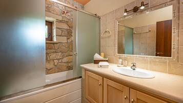 Separate bathtub and shower, hair dryer, bathrobes, slippers