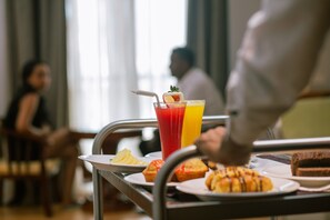 Enjoy a delicious breakfast spread with a variety of fresh fruit, pastries, and juices.