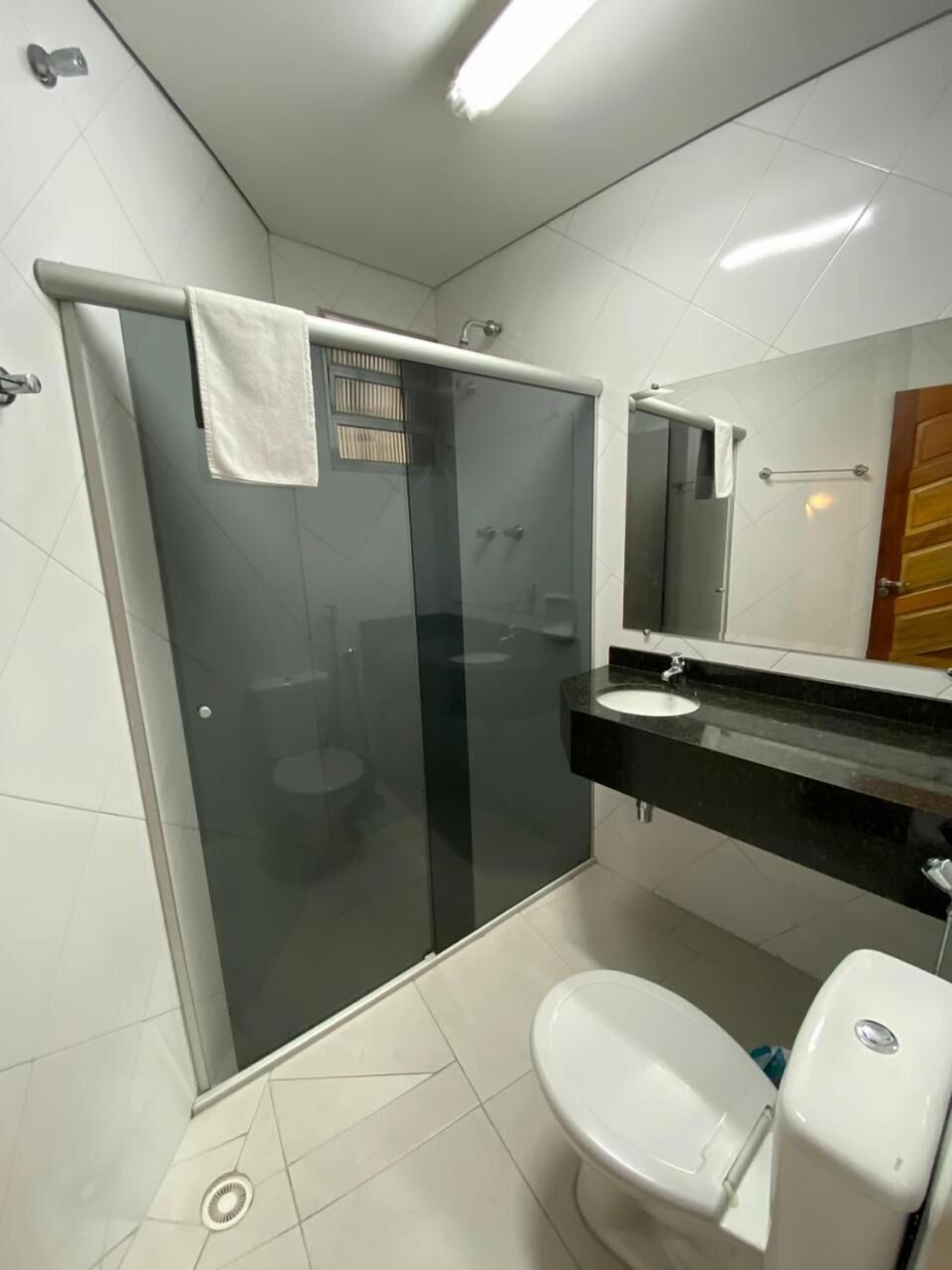 shower, rainfall showerhead, hair dryer, towels