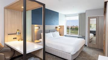 Premium bedding, desk, laptop workspace, blackout curtains