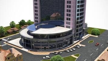 Un bâtiment moderne doté d’une cour intérieure, d’un parking souterrain et d’un espace verdoyant.