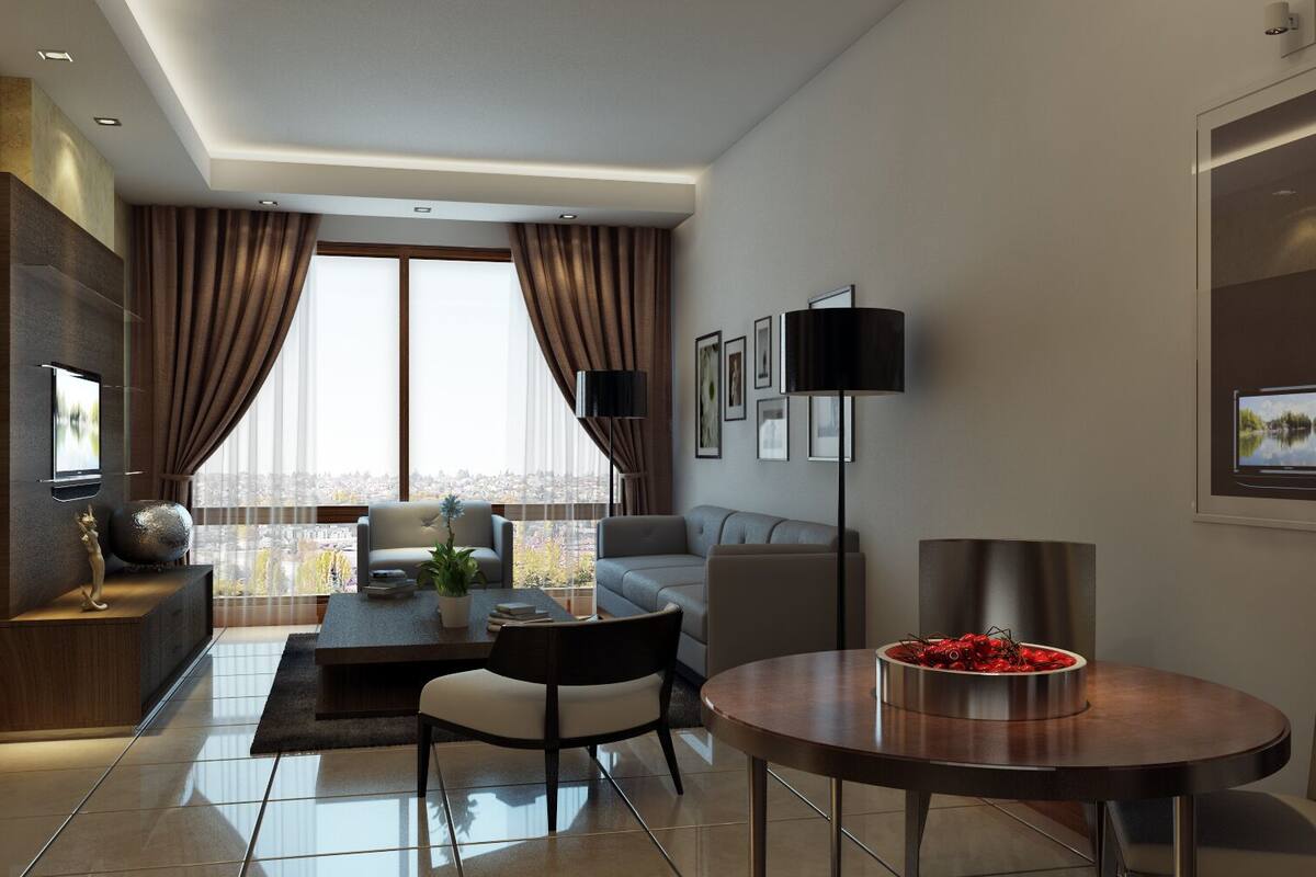Une chambre d’hôtel moderne dotée d’une grande fenêtre, d’un téléviseur à écran plat, d’un coin repas avec une table ronde et d’un canapé.