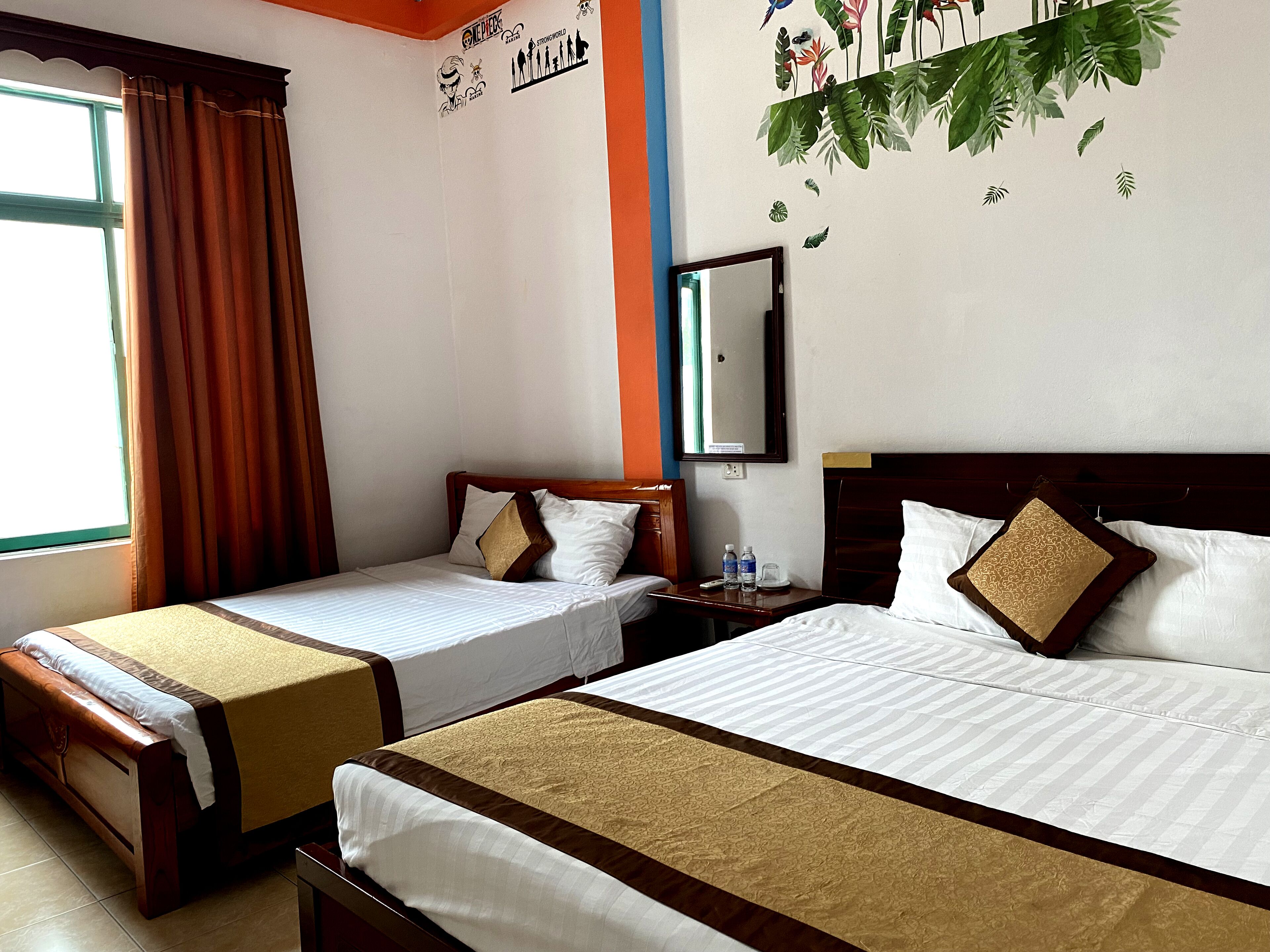 Deluxe Quadruple Room | Down comforters, pillowtop beds, minibar, individually furnished