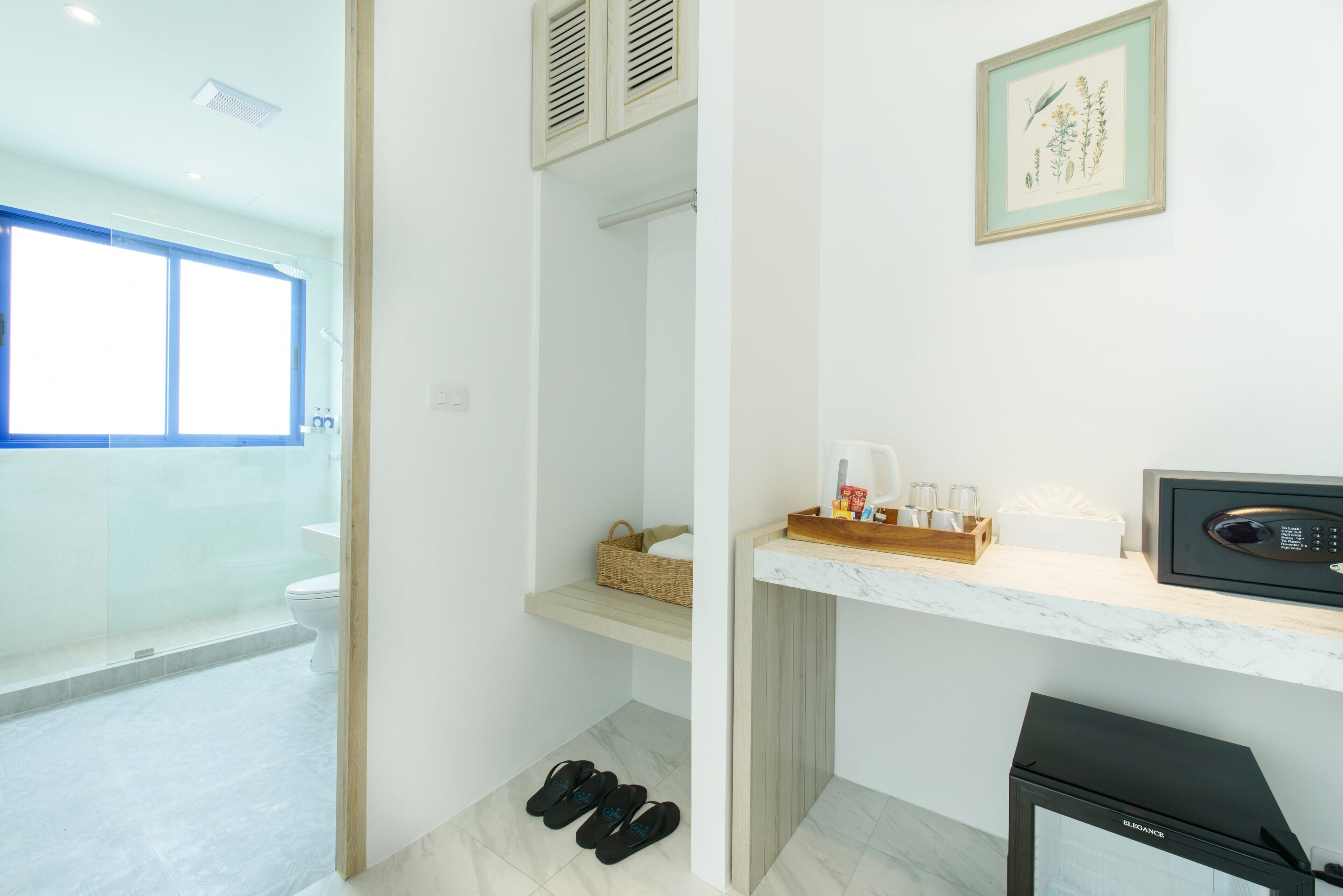 A modern bathroom with a shower, a toilet, and a sink area.