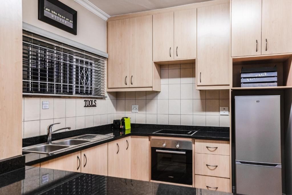 Appartement | Privékeuken | Een koelkast/vriezer, een magnetron, een oven, een kookplaat