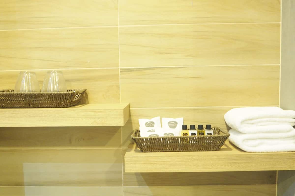 deluxe pool access with balcony  | bathroom | designer toiletries, hair dryer, bathrobes, slippers