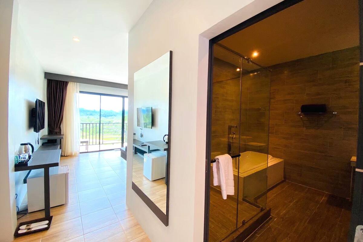 deluxe bathtub mountain | bathroom | designer toiletries, hair dryer, bathrobes, slippers