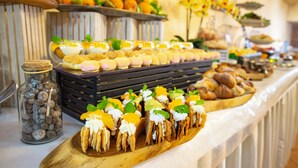 A buffet with various food items including pastries, fruits, and desserts. - Kiev365 (Sofiivska Borschahivka)