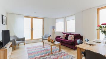 Apartment, 2 Bedrooms | Living room | Flat-screen TV