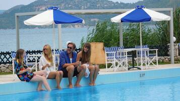 Outdoor pool, pool umbrellas, sun loungers