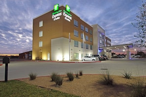 A Holiday Inn Express & Suites hotel with a parking lot and a fire lane. - Holiday Inn Express & Suites Brookshire - Katy Freeway by IHG (Brookshire)