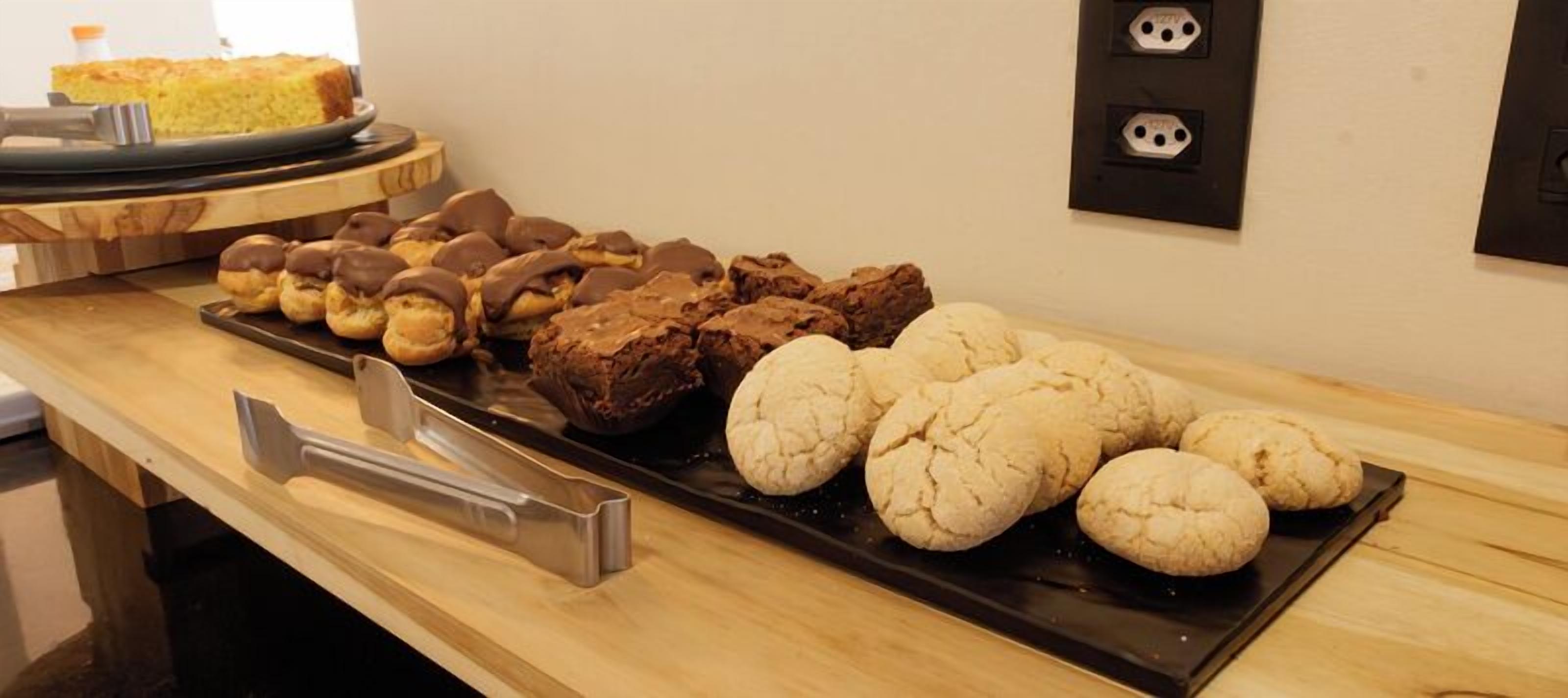 A tray of assorted baked goods on a wooden counter.