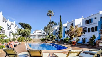 Seasonal outdoor pool, pool umbrellas, pool loungers