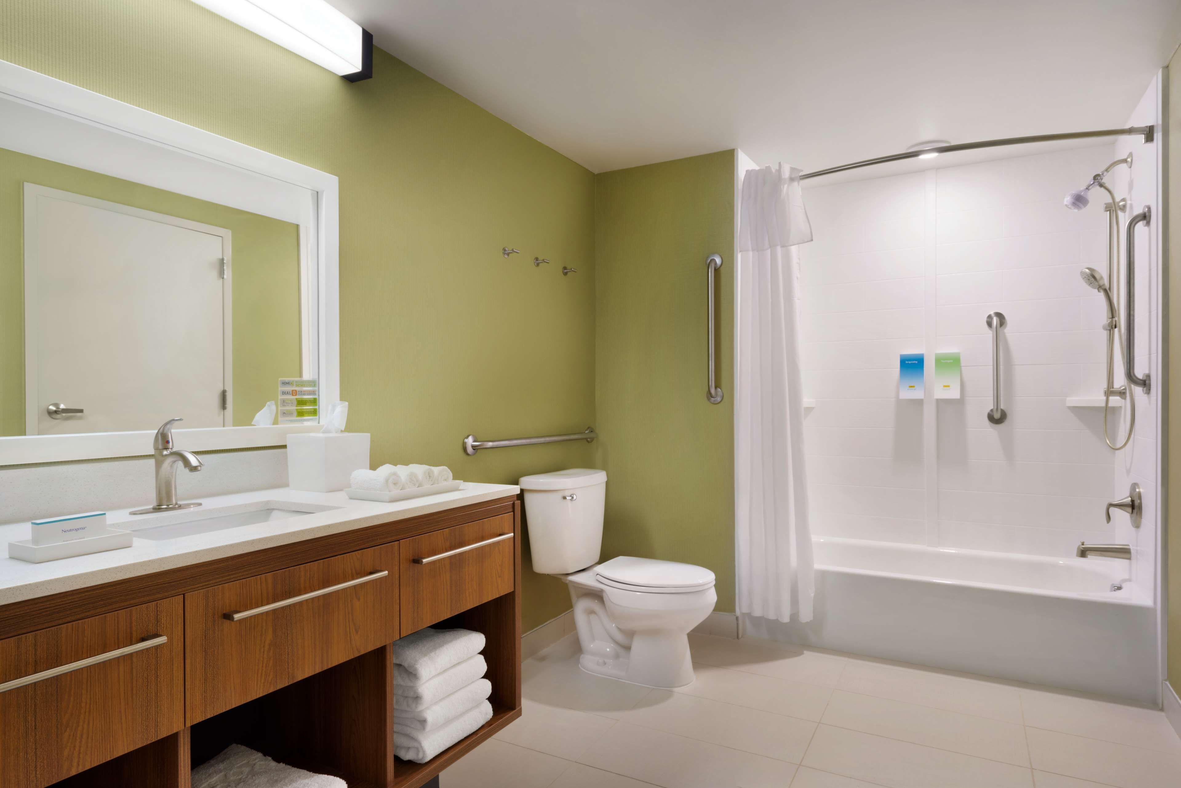 A bathroom with a sink, toilet, and bathtub.